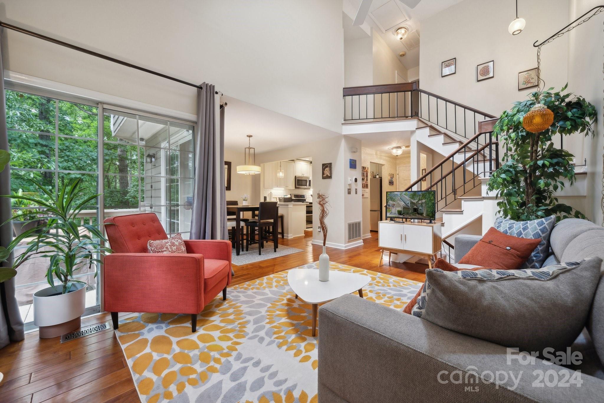 9012 St Thomas Lane Charlotte, NC 28277 - Photo 4 of 25 a living room with furniture and a large window