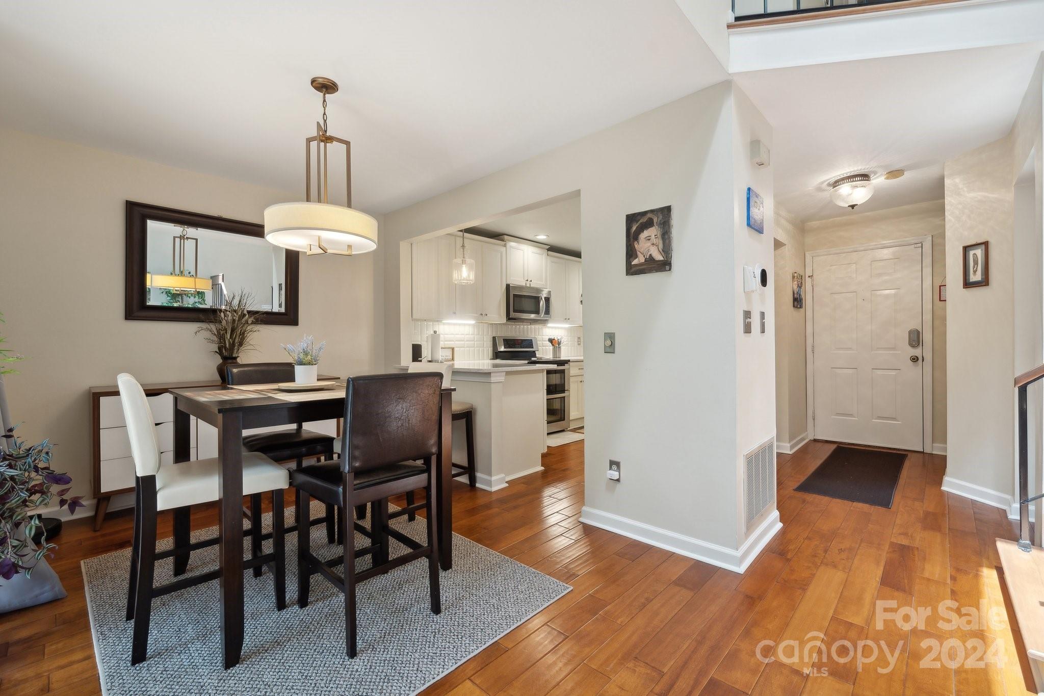 9012 St Thomas Lane Charlotte, NC 28277 - Photo 6 of 25 a view of a dining room with furniture window and wooden floor