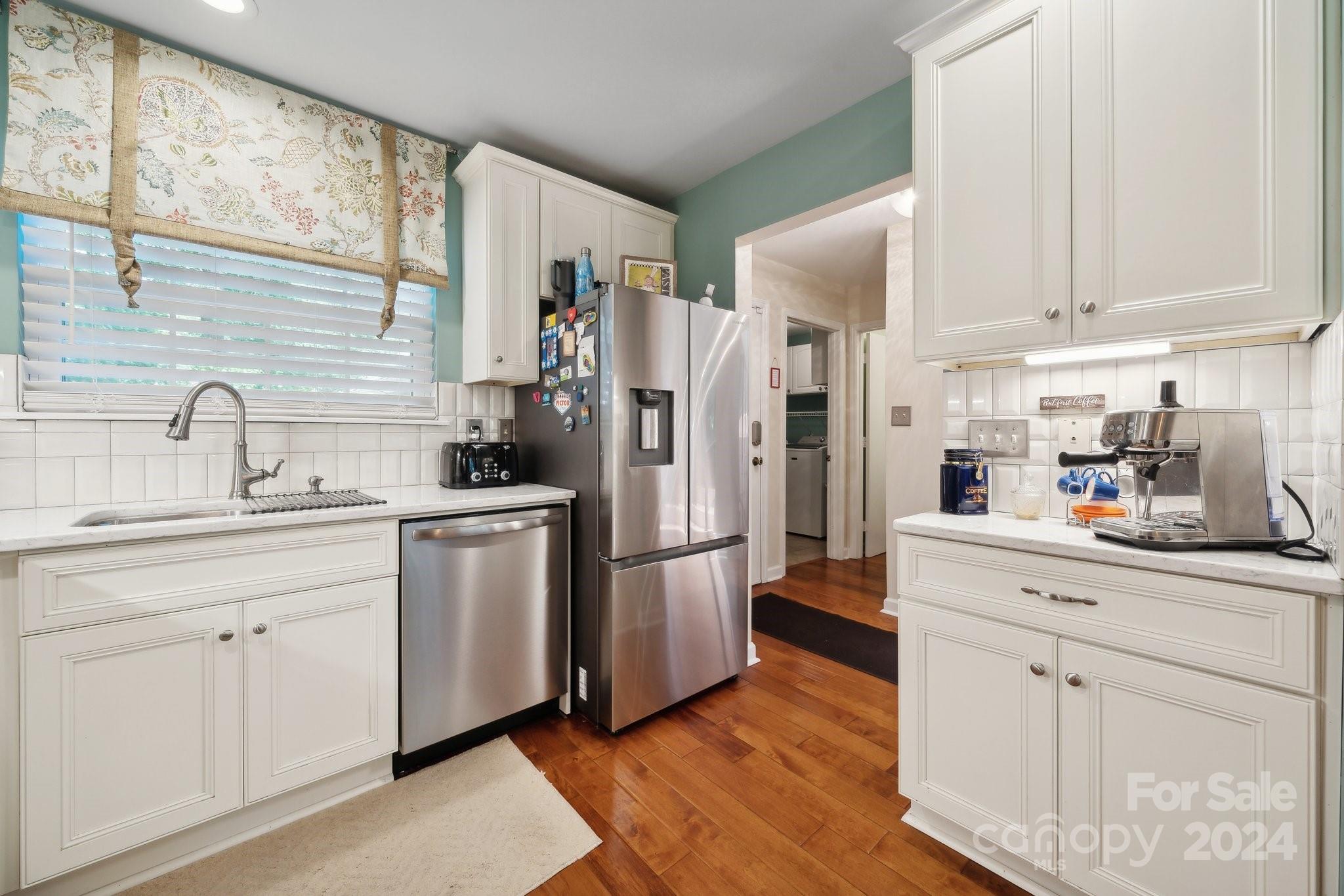9012 St Thomas Lane Charlotte, NC 28277 - Photo 10 of 25 a kitchen with stainless steel appliances a refrigerator sink and cabinets