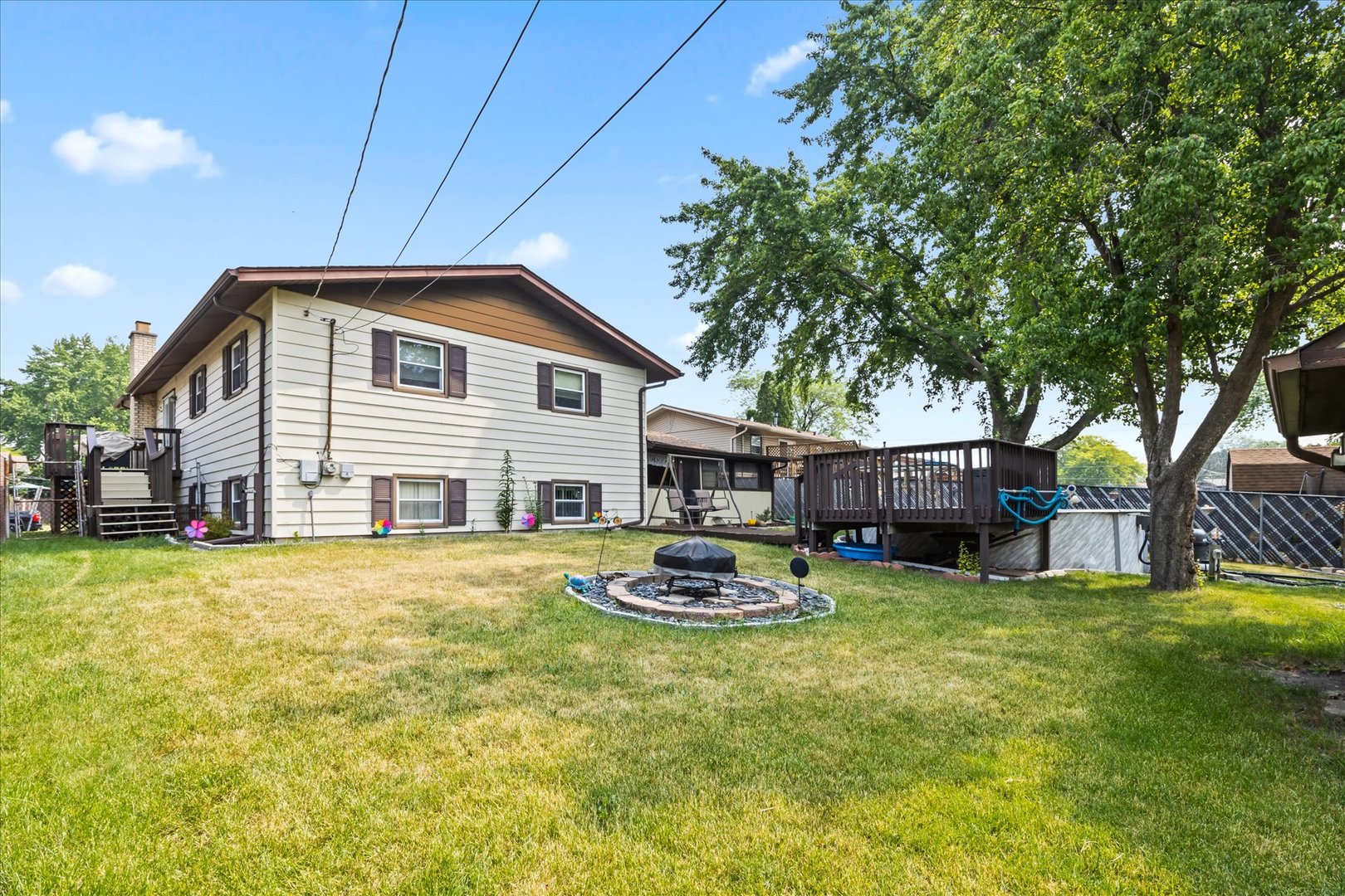 6349 Forestview Drive Oak Forest, IL 60452 - Photo 18 of 18 a backyard of a house with garden and outdoor seating