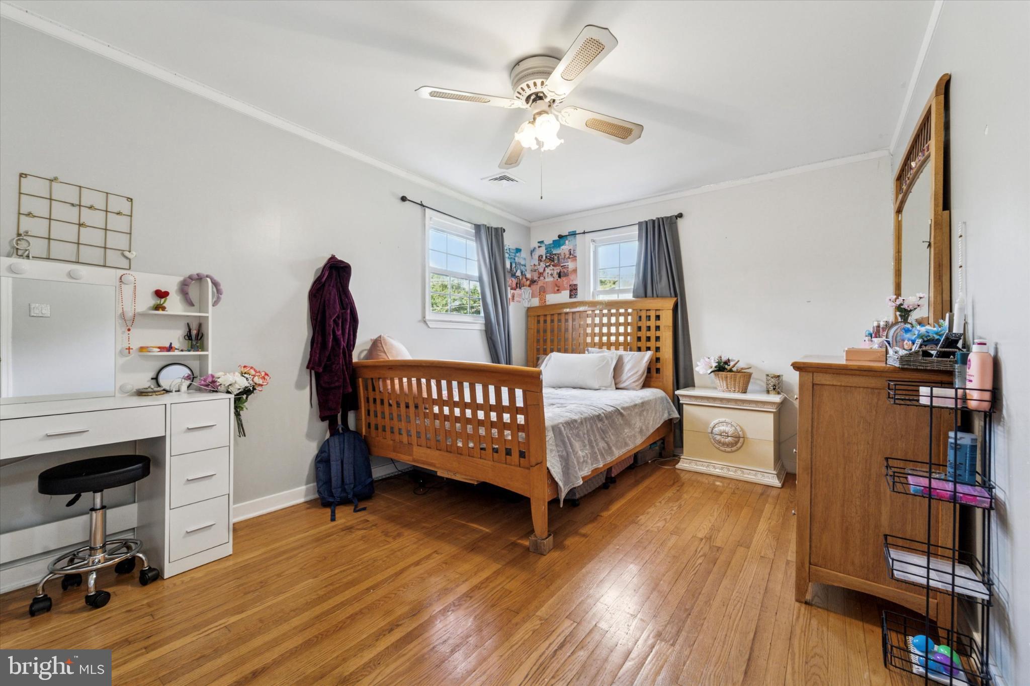 735 Spring Hill Road Feasterville-Trevose, PA 19053 - Photo 18 of 34 Cozy bedroom with natural light and charm.