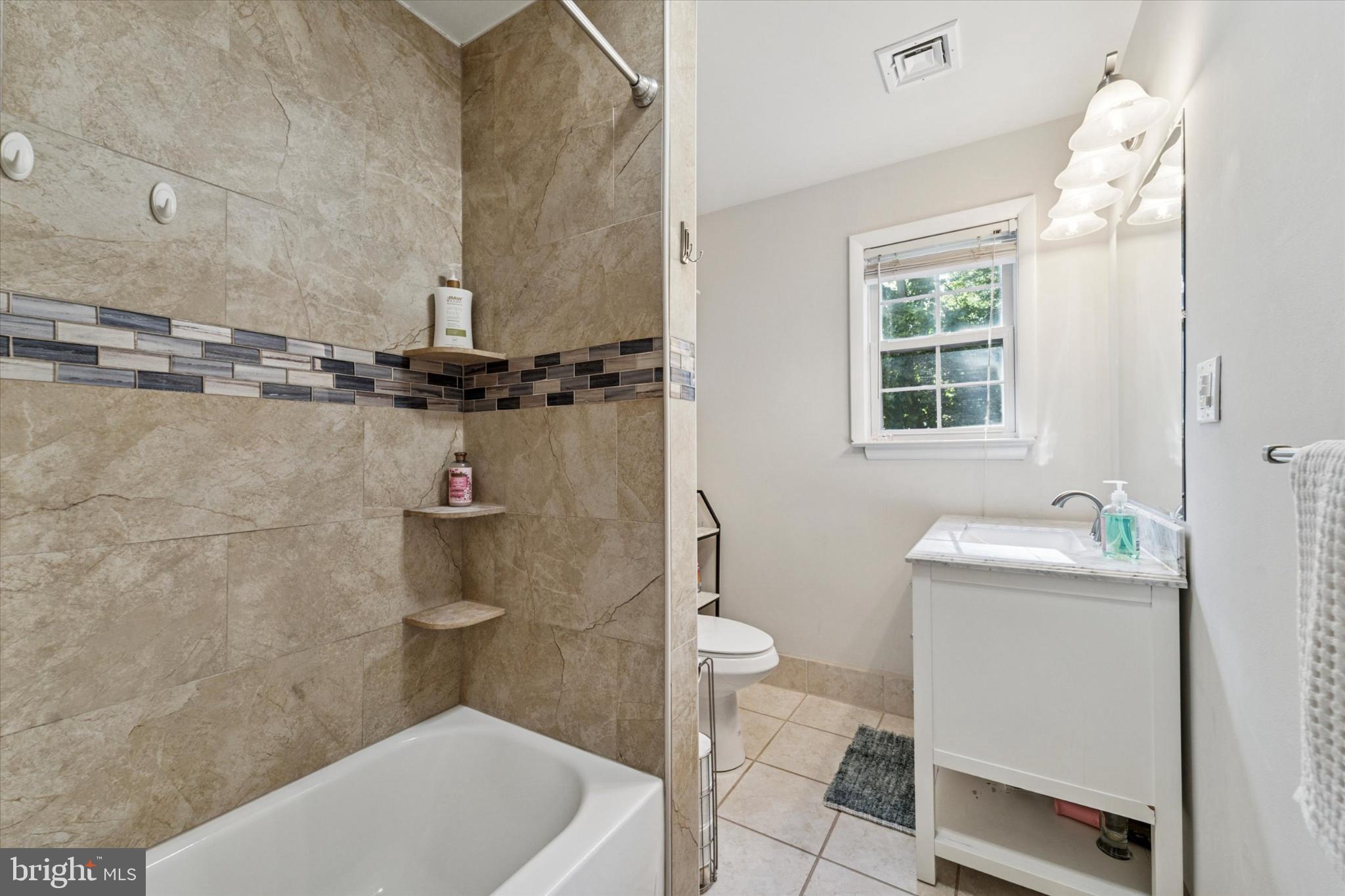 735 Spring Hill Road Feasterville-Trevose, PA 19053 - Photo 21 of 34 Modern bathroom with elegant tile accents.