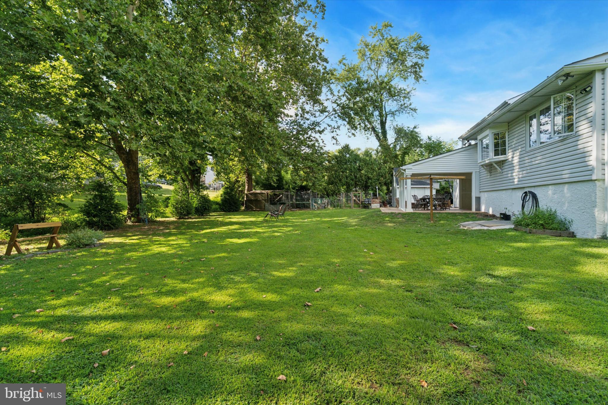 735 Spring Hill Road Feasterville-Trevose, PA 19053 - Photo 27 of 34 Spacious backyard oasis with lush greenery.