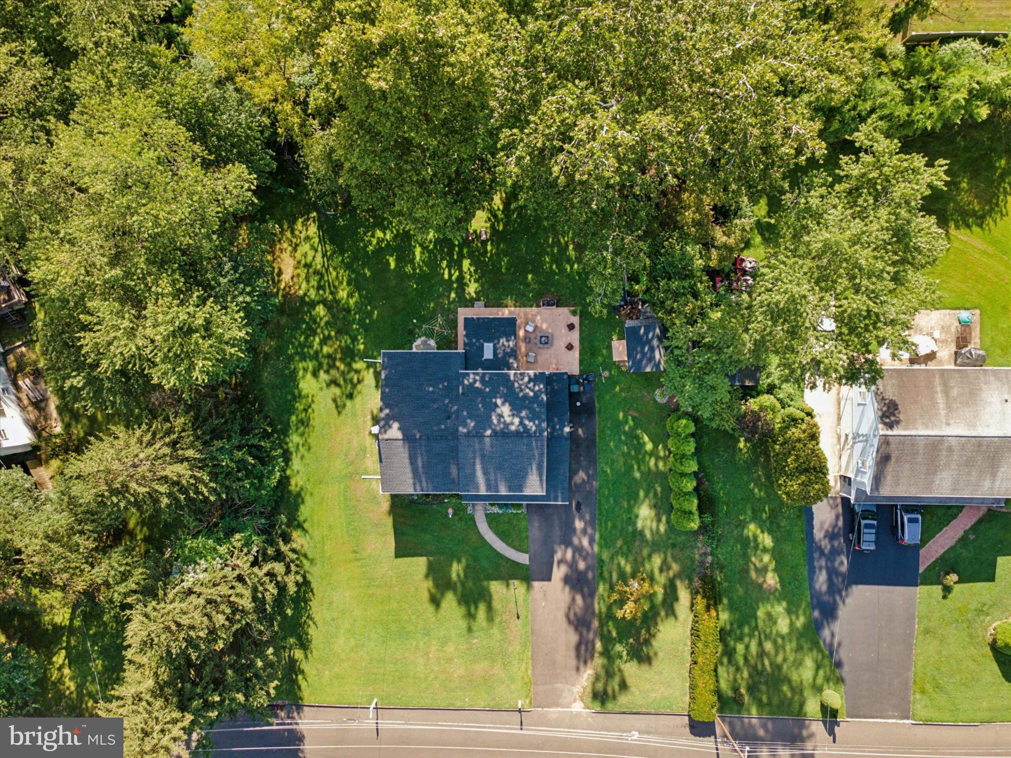 735 Spring Hill Road Feasterville-Trevose, PA 19053 - Photo 29 of 34 Lush greenery surrounds a charming home.