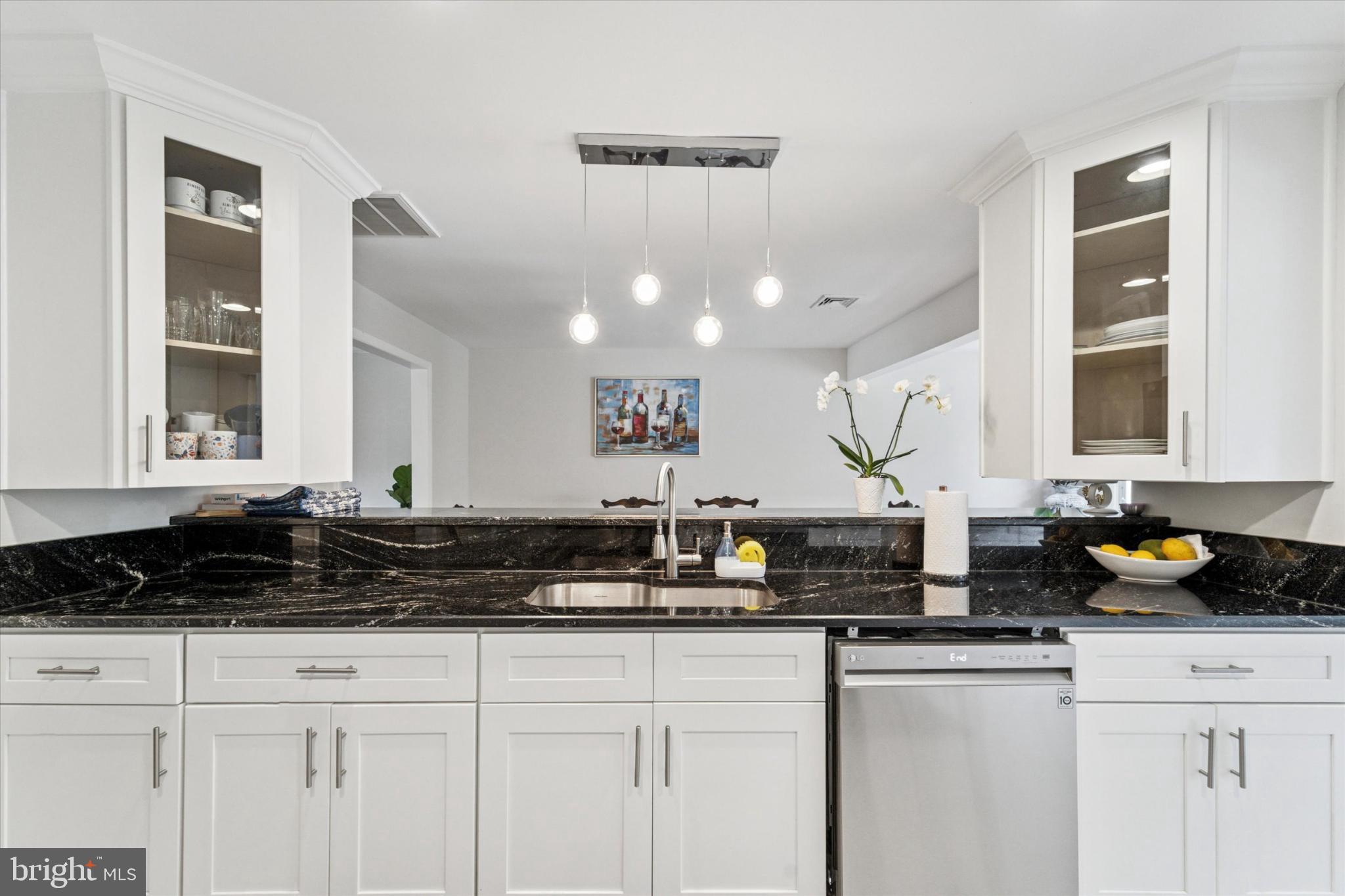 735 Spring Hill Road Feasterville-Trevose, PA 19053 - Photo 6 of 34 Sleek kitchen with modern elegance and style.