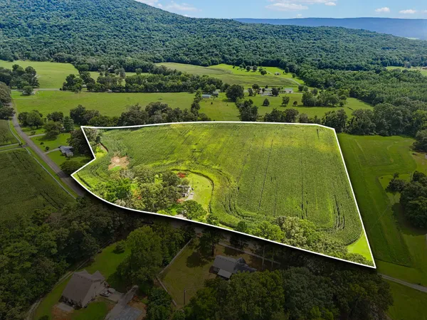 an aerial view of a golf course with a swimming pool