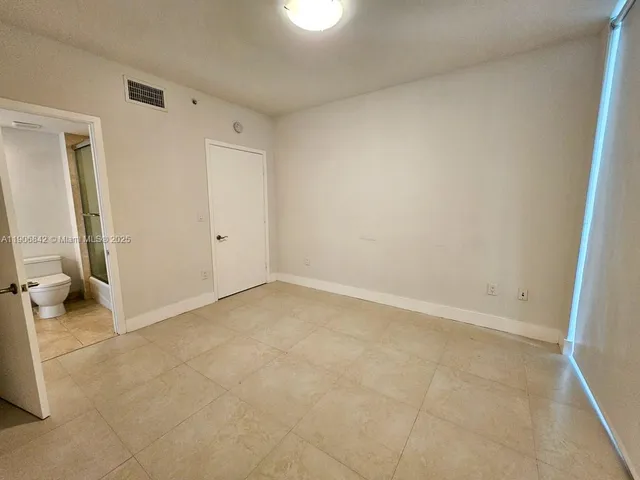 an empty room with a bathroom
