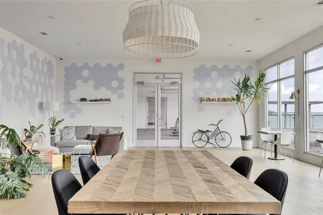 a view of a livingroom with furniture window and wooden floor