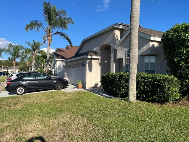 a view of a car parked in front of a house