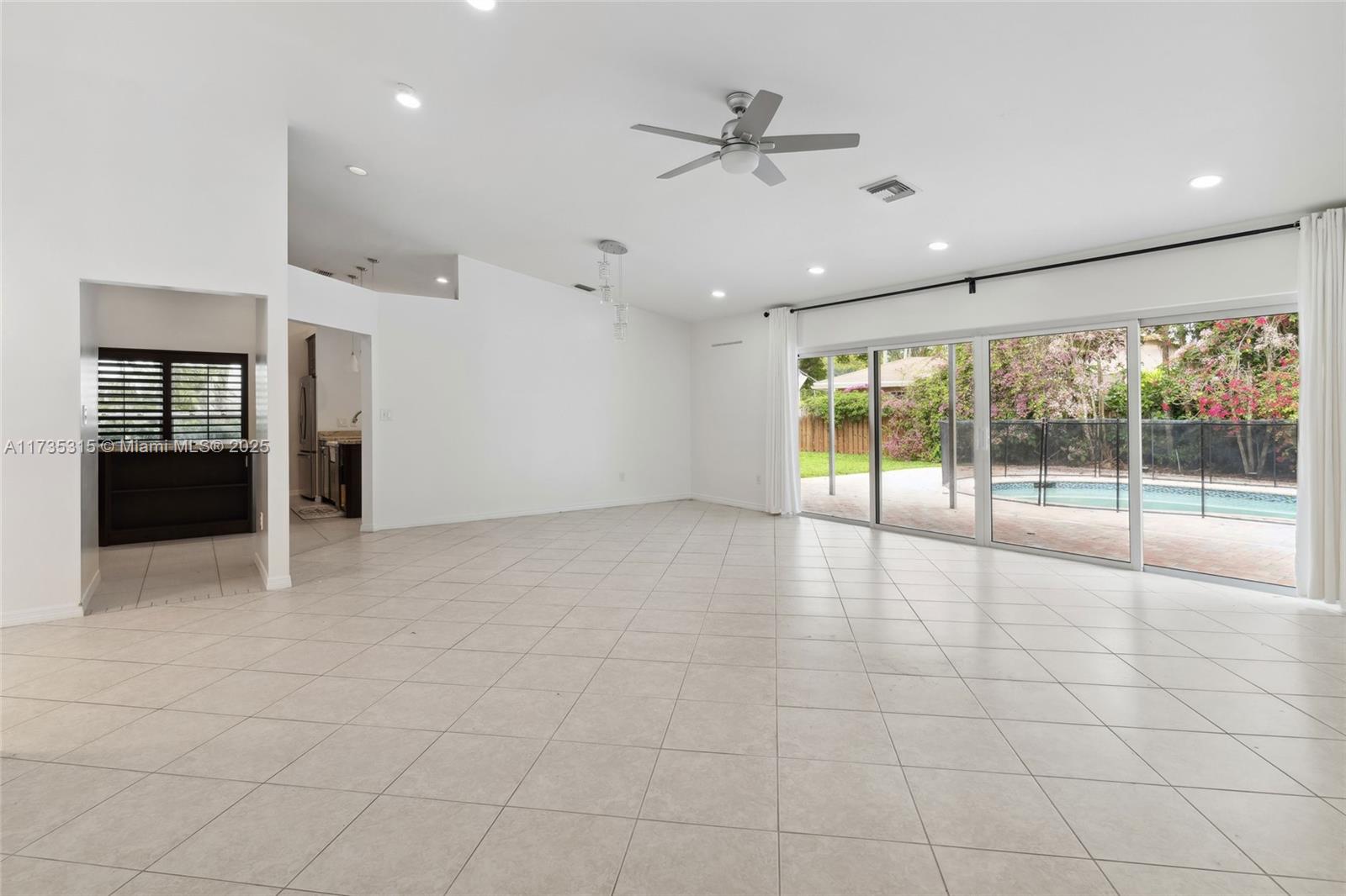 11601 Island Road Cooper City, FL 33026 - Photo 16 of 35 a view of an empty room with a window