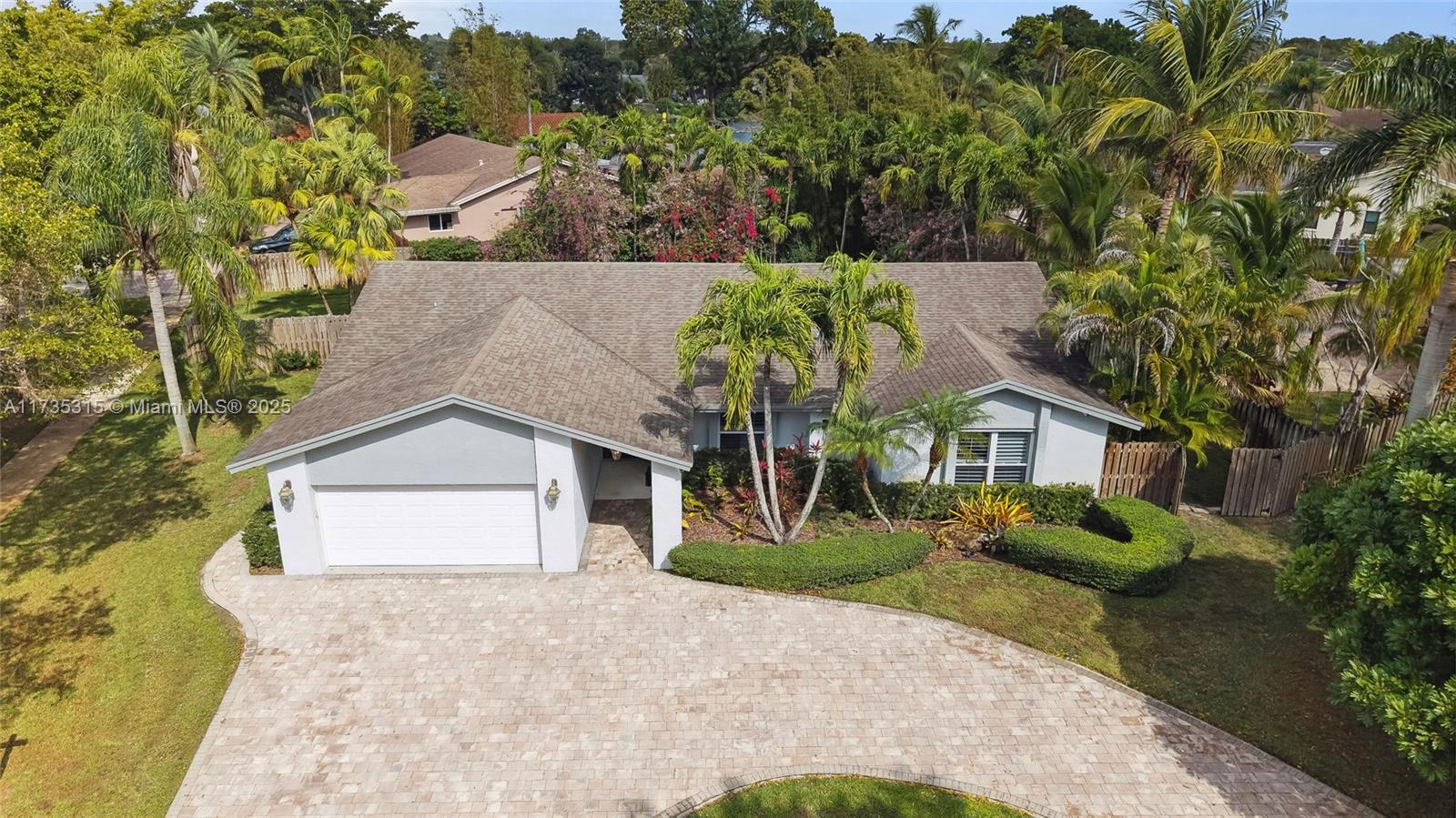 11601 Island Road Cooper City, FL 33026 - Photo 3 of 35 an aerial view of a house with a yard and potted plants
