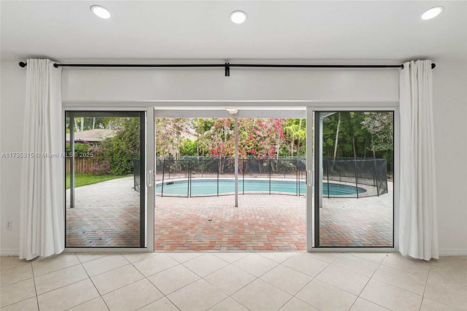 11601 Island Road Cooper City, FL 33026 - Photo 31 of 35 a view of a room with sliding door and mountain view