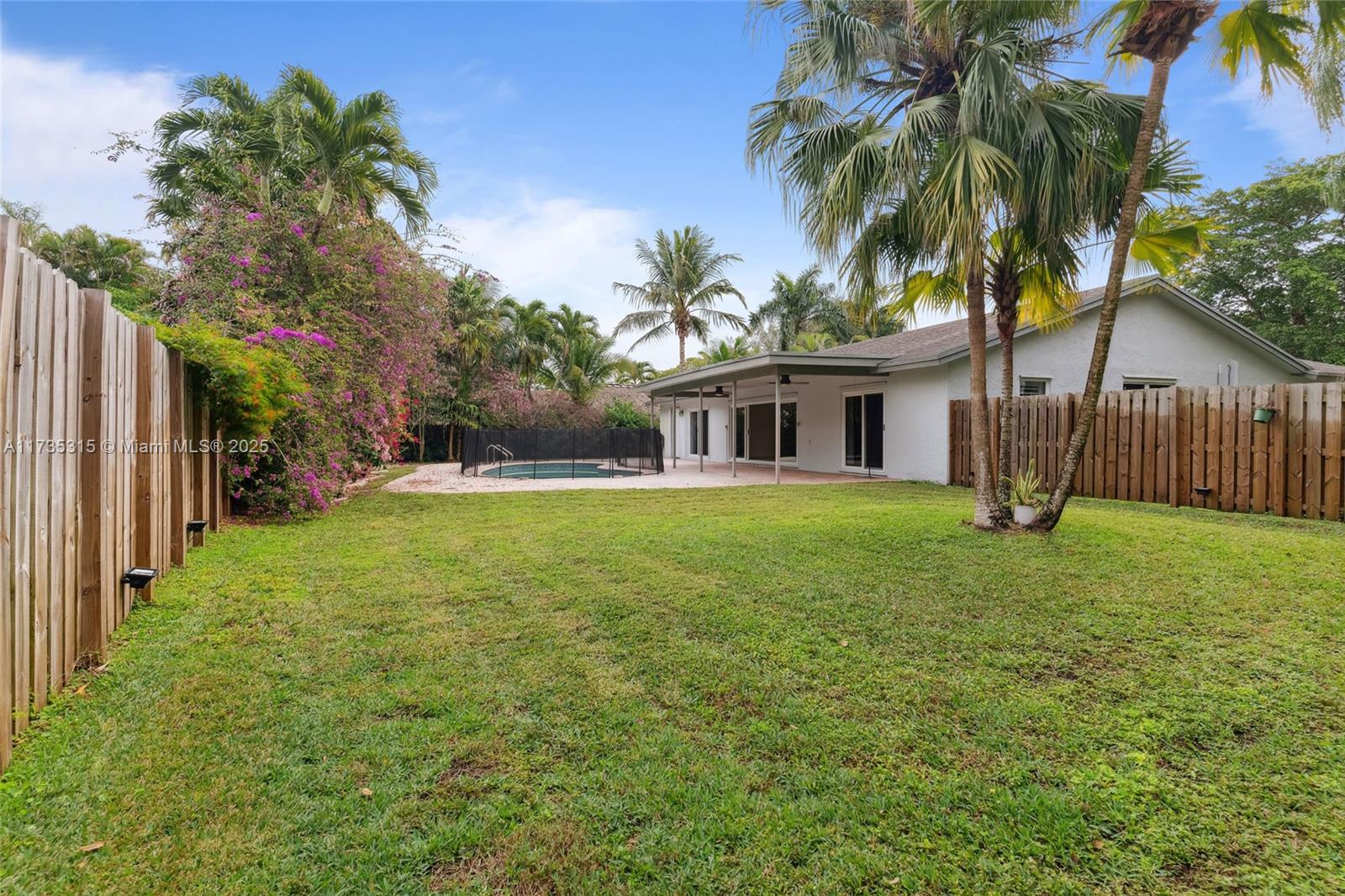 11601 Island Road Cooper City, FL 33026 - Photo 35 of 35 a front view of house with yard and green space
