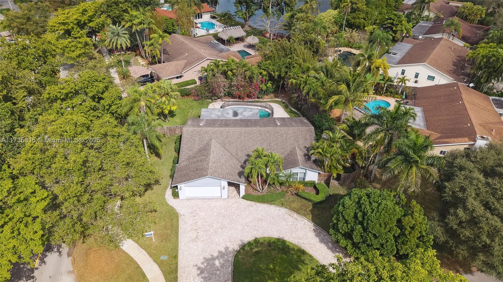 11601 Island Road Cooper City, FL 33026 - Photo 5 of 35 a picture of a yard