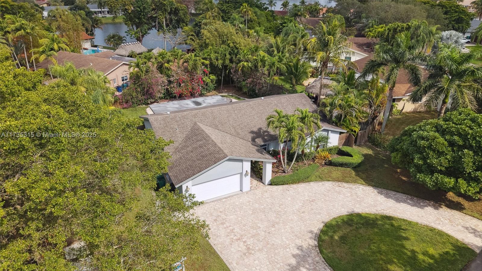 11601 Island Road Cooper City, FL 33026 - Photo 6 of 35 an aerial view of a house with a yard