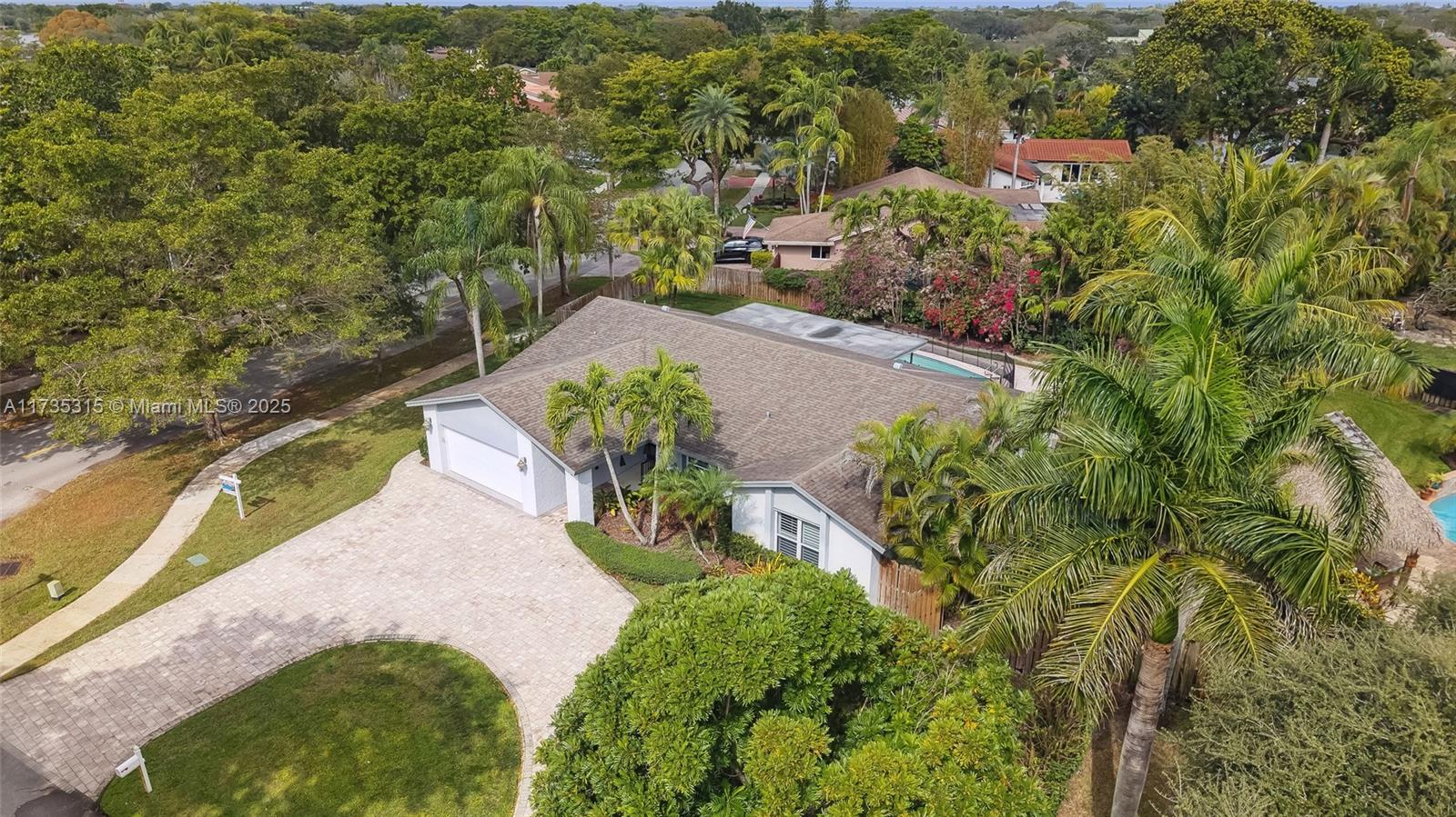 11601 Island Road Cooper City, FL 33026 - Photo 7 of 35 a view of a garden with lawn chairs