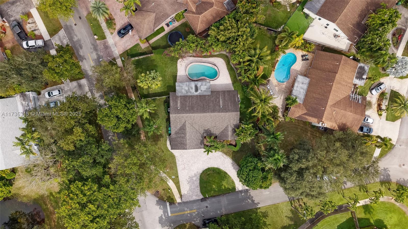 11601 Island Road Cooper City, FL 33026 - Photo 8 of 35 an aerial view of a house with a yard and garden