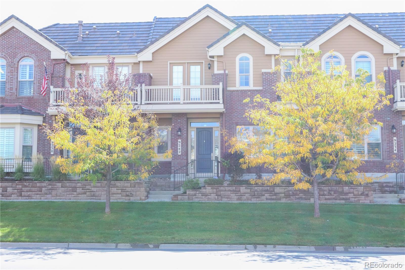9242 Ridgegate Parkway Lone Tree, CO 80124 - Photo 22 of 28 a front view of a house with garden