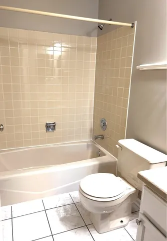 a bathroom with a toilet bathtub and shower