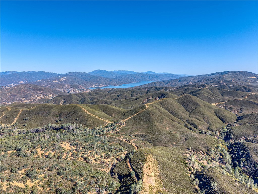 1034 Round Ball Road Clearlake Oaks, CA 95423 - Photo 26 of 46 a view of a lake with mountains in the background