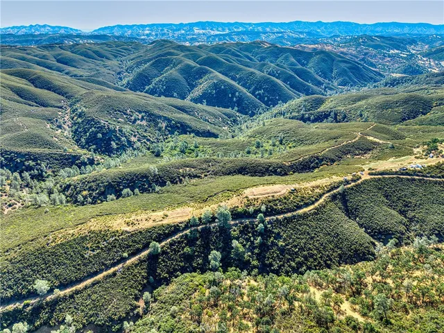 a view of a and mountain in a field