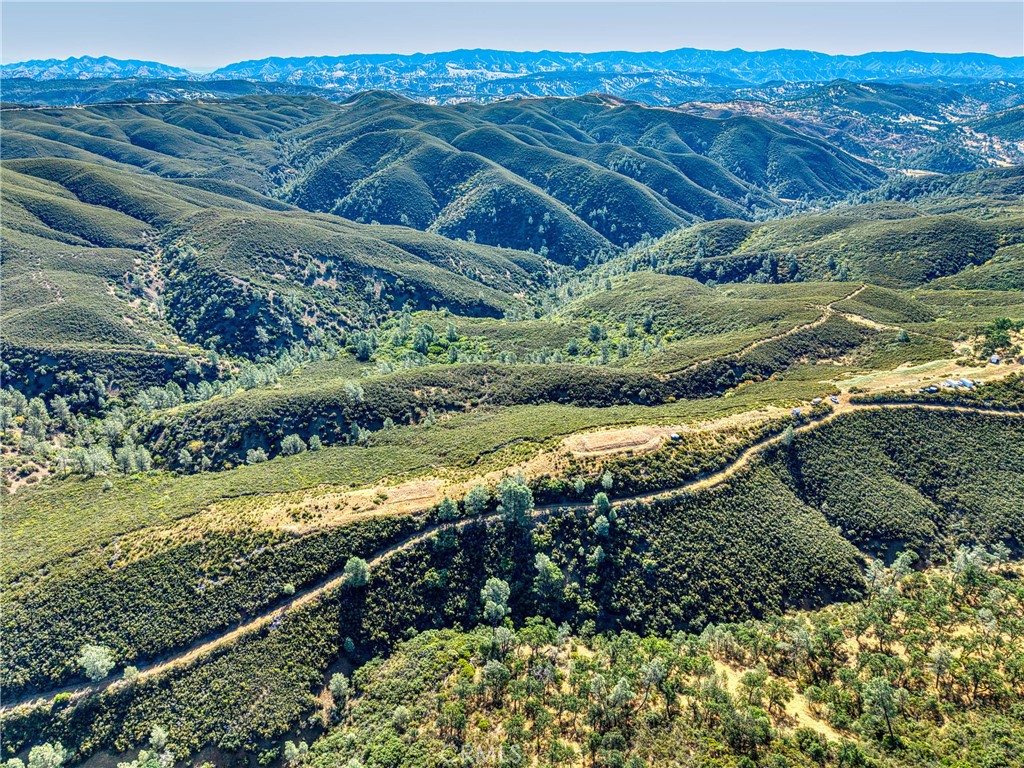 1034 Round Ball Road Clearlake Oaks, CA 95423 - Photo 27 of 46 a view of a yard with wooden fence