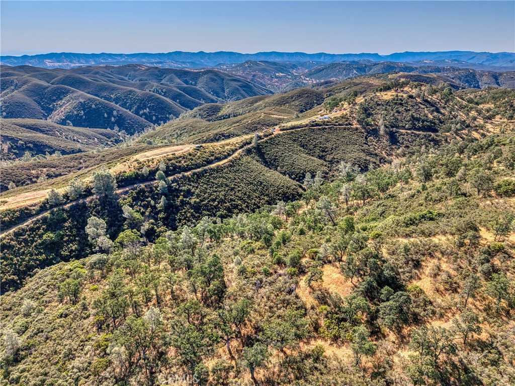 1034 Round Ball Road Clearlake Oaks, CA 95423 - Photo 29 of 46 a view of a and mountain in a field