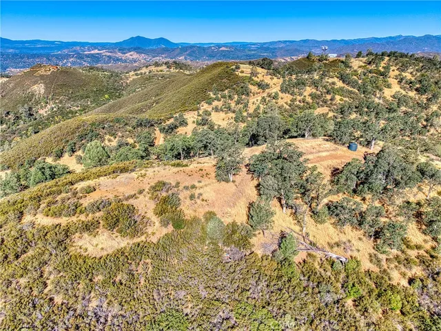 a view of an outdoor space and a mountain view in back
