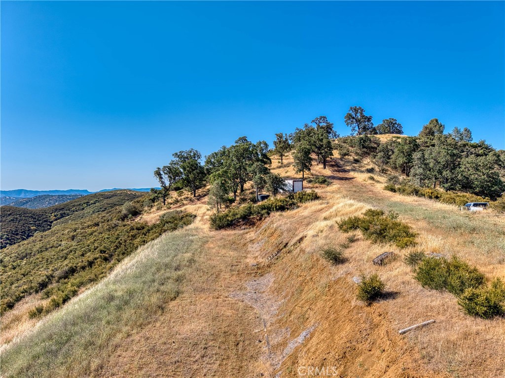 1034 Round Ball Road Clearlake Oaks, CA 95423 - Photo 45 of 46 a view of a beach with a mountain in the background