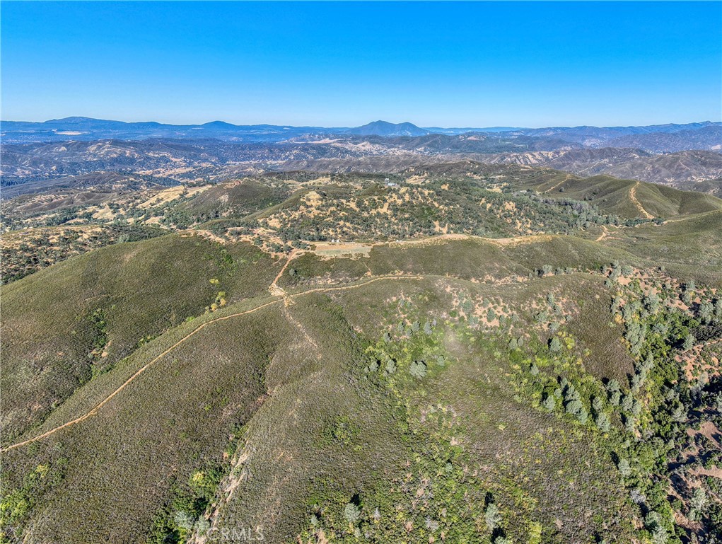 1034 Round Ball Road Clearlake Oaks, CA 95423 - Photo 10 of 46 a view of a lake with mountains in the background