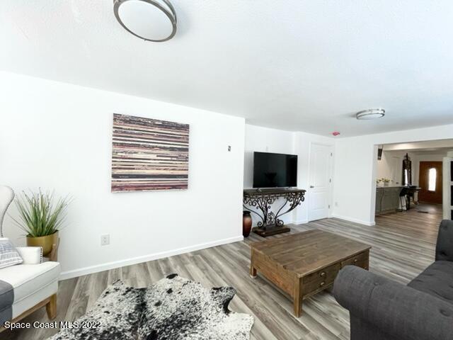 2855 Diamond Road Titusville, FL 32796 - Photo 15 of 61 a living room with furniture and a flat screen tv
