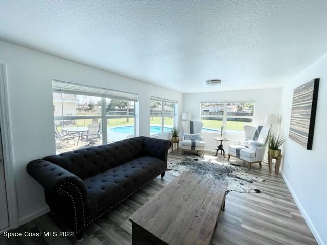 2855 Diamond Road Titusville, FL 32796 - Photo 16 of 61 a living room with furniture and a large window