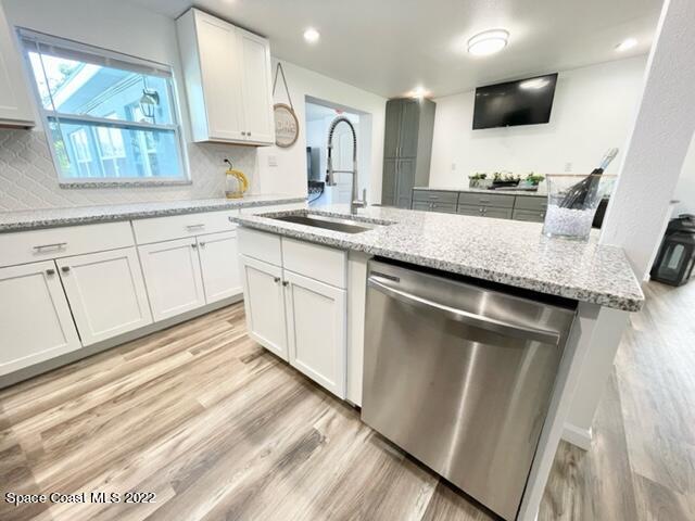 2855 Diamond Road Titusville, FL 32796 - Photo 20 of 61 a kitchen with granite countertop a sink stainless steel appliances and cabinets