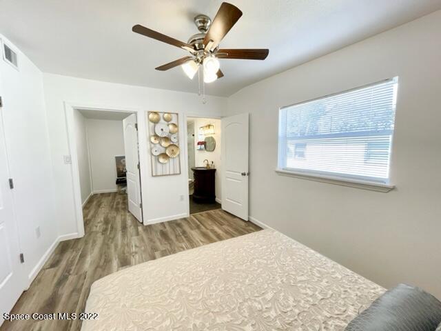 2855 Diamond Road Titusville, FL 32796 - Photo 34 of 61 a living room with a bed furniture and a window