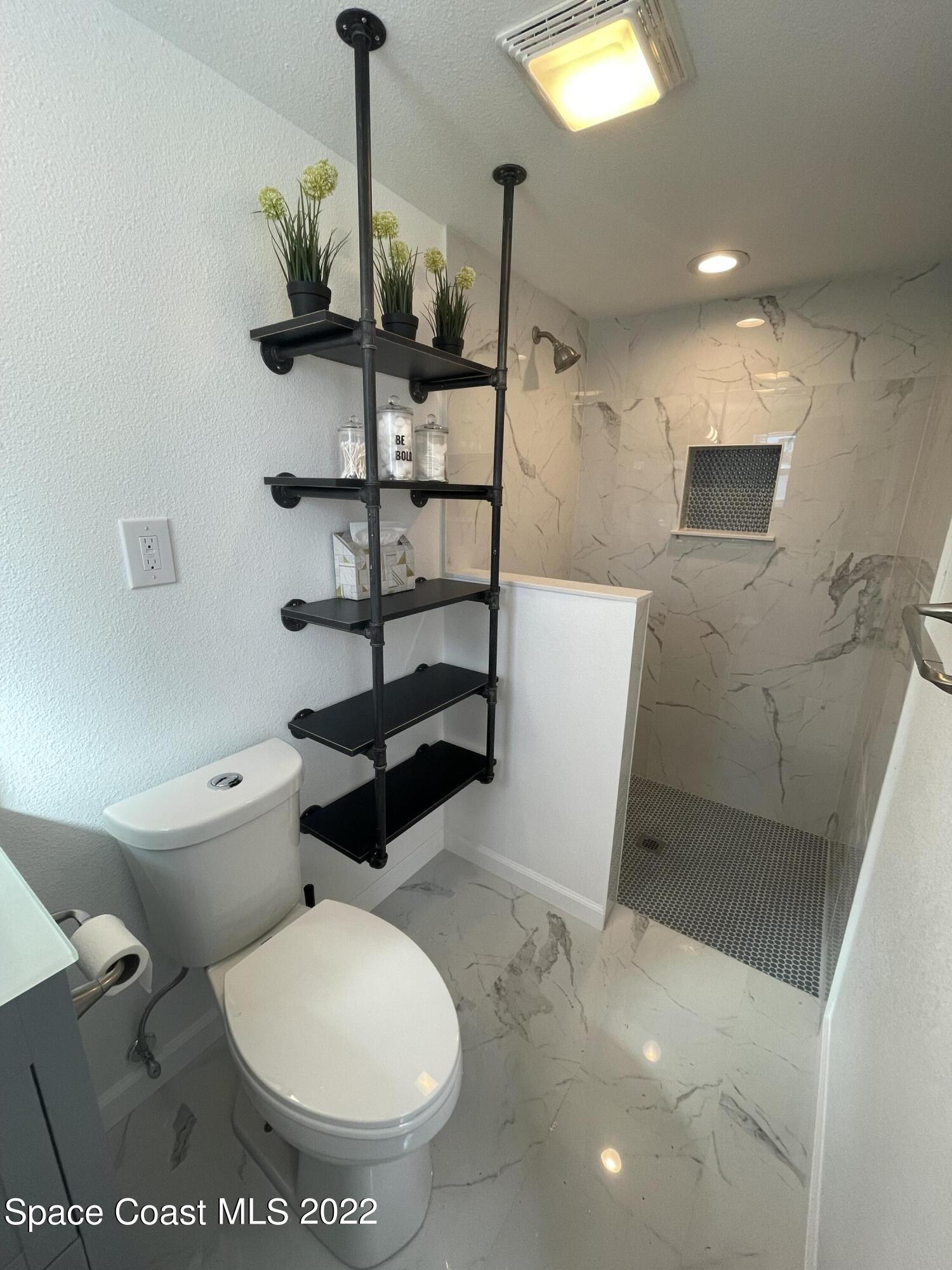 2855 Diamond Road Titusville, FL 32796 - Photo 39 of 61 a bathroom with a toilet and a sink