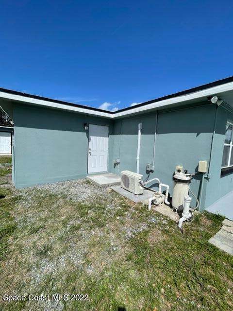 2855 Diamond Road Titusville, FL 32796 - Photo 51 of 61 a backyard of a house with table and chairs