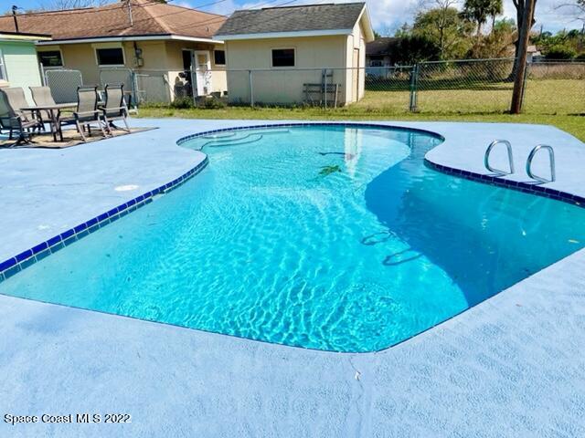 2855 Diamond Road Titusville, FL 32796 - Photo 52 of 61 a view of a swimming pool with a patio