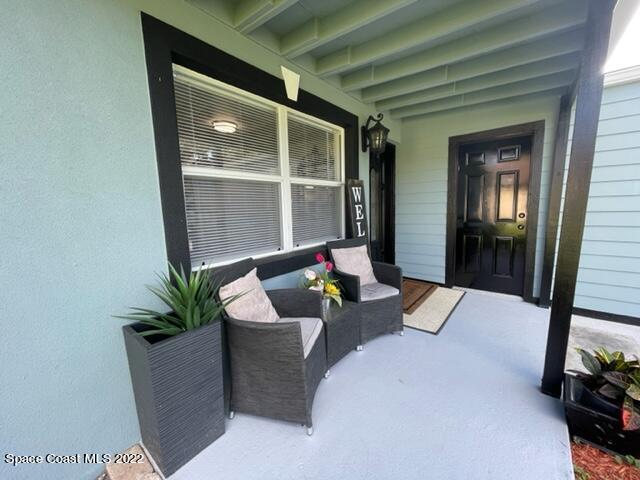 2855 Diamond Road Titusville, FL 32796 - Photo 9 of 61 a living room with furniture and a potted plant