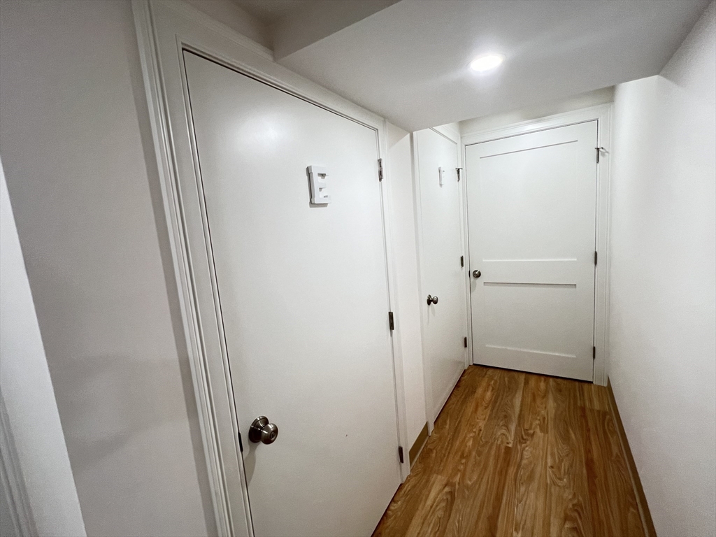 489 Main Street, Unit E Stoneham, MA 02180 - Photo 13 of 14 a bathroom with a sink and shower
