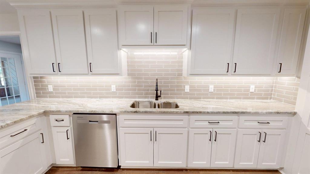 1110 Mill Run Road Athens, TX 75751 - Photo 7 of 32 a kitchen with white cabinets and white appliances