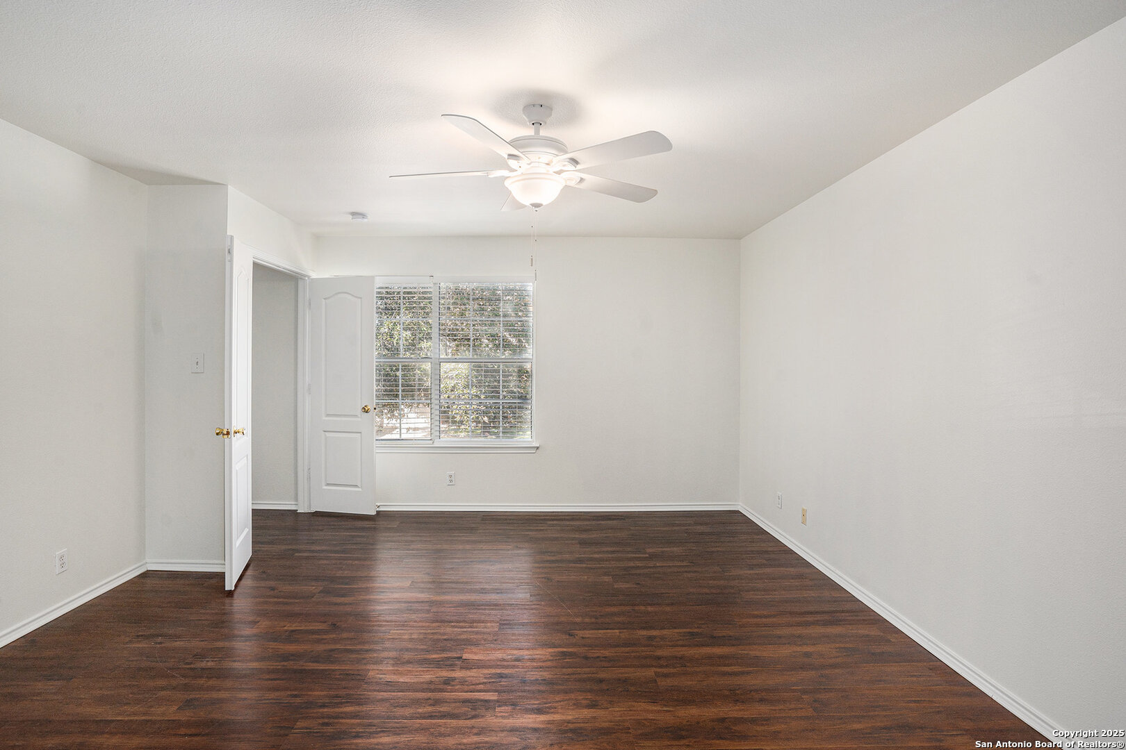 9106 Valhalla Selma, TX 78154 - Photo 14 of 17 a view of wooden floor and windows in a room