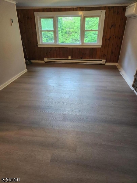 72 Glenwood Mt Road Vernon, NJ 07461 - Photo 11 of 12 an empty room with wooden floor and windows