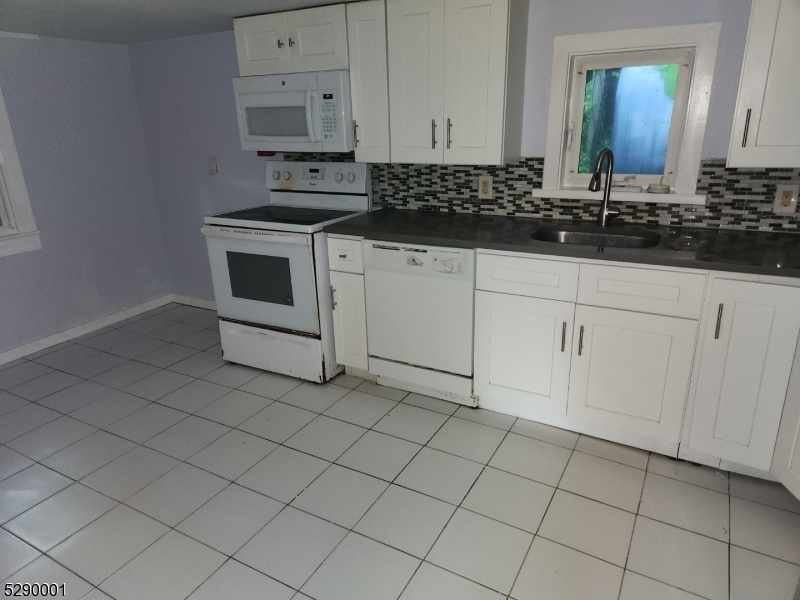 72 Glenwood Mt Road Vernon, NJ 07461 - Photo 2 of 12 a kitchen with cabinets and appliances