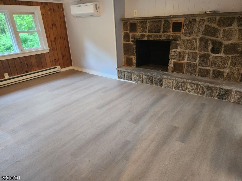 72 Glenwood Mt Road Vernon, NJ 07461 - Photo 3 of 12 a view of an empty room with a fireplace