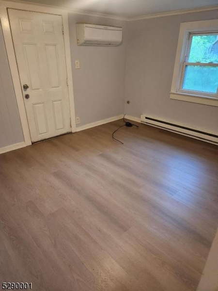 72 Glenwood Mt Road Vernon, NJ 07461 - Photo 5 of 12 a view of a room with wooden floor and cabinet