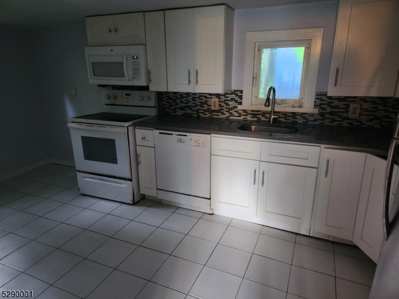 72 Glenwood Mt Road Vernon, NJ 07461 - Photo 8 of 12 a kitchen with cabinets and appliances