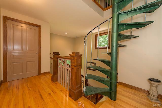 1025 Morvale Road Easton, PA 18042 - Photo 23 of 34 a view of a hallway with wooden floor and staircase