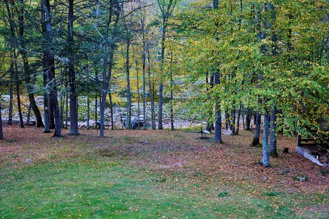 a view of backyard with sitting area and garden