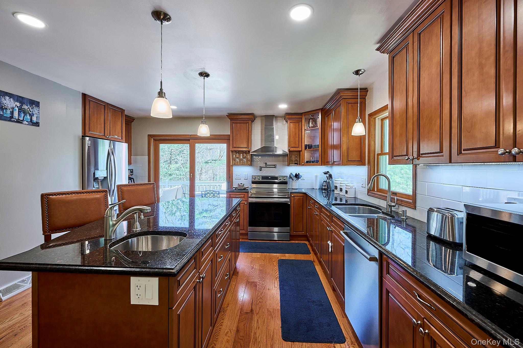 39 Pitio Road Glen Spey, NY 12737 - Photo 24 of 50 a kitchen with granite countertop a sink a counter space appliances and cabinets