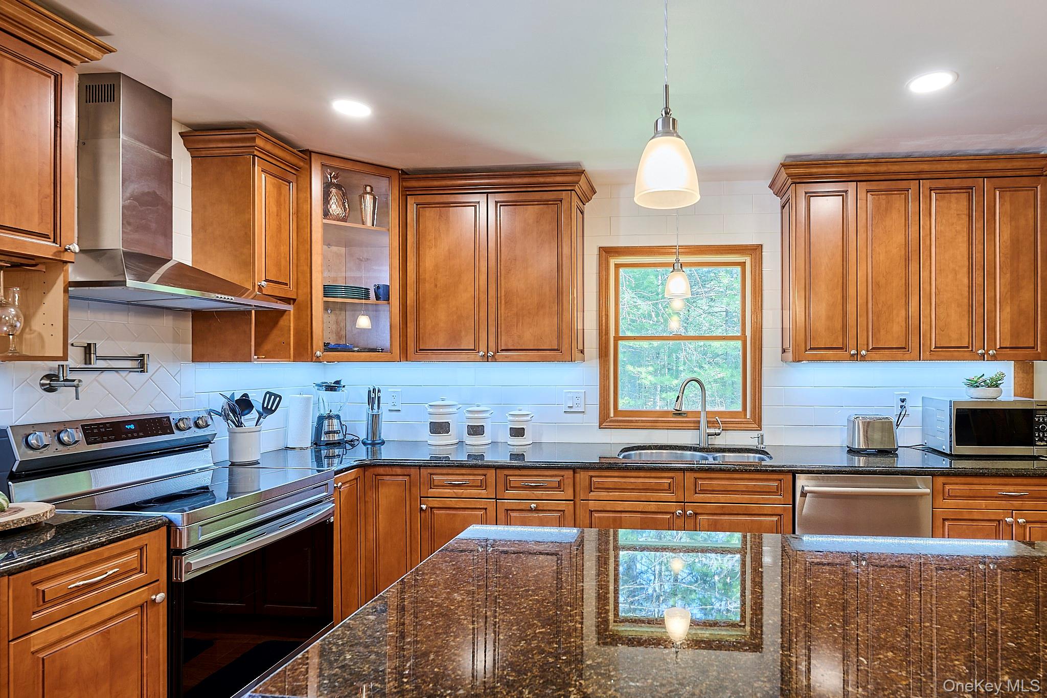39 Pitio Road Glen Spey, NY 12737 - Photo 25 of 50 a kitchen with stainless steel appliances granite countertop sink stove and cabinets